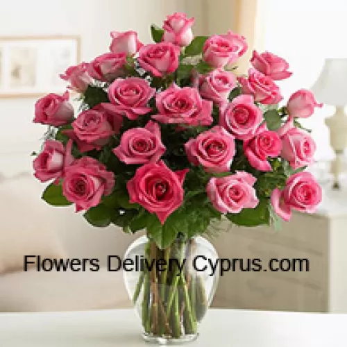 36 Pink Roses With Some Ferns In A Glass Vase