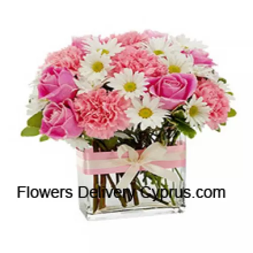Pink Roses, Pink Carnations And Assorted White Seasonal Flowers Arranged Beautifully In A Glass Vase