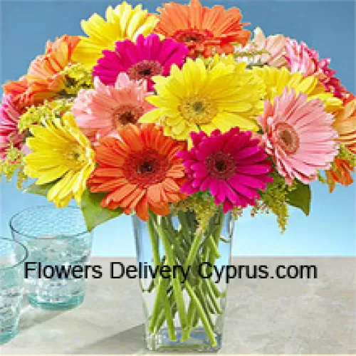 24 Mixed Colored Gerberas With Some Ferns In A Glass Vase
