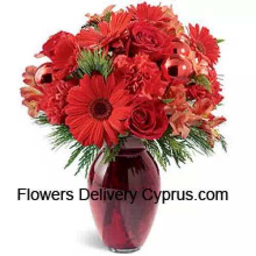 A beautiful holiday red glass vase holds an array of crimson blossoms. Carnations, roses, Gerbera daisies and alstroemeria are decorated with shiny red glass ornaments and interspersed with Chinese New Year greens. Great to give, or to keep for yourself!  (Please Note That We Reserve The Right To Substitute Any Product With A Suitable Product Of Equal Value In Case Of Non-Availability Of A Certain Product)